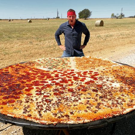 William Sonbuchner was photographed with one of the biggest pizzas.